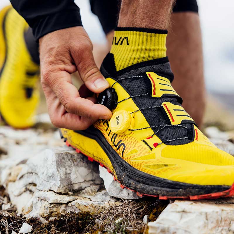 Yellow and black running shoes top